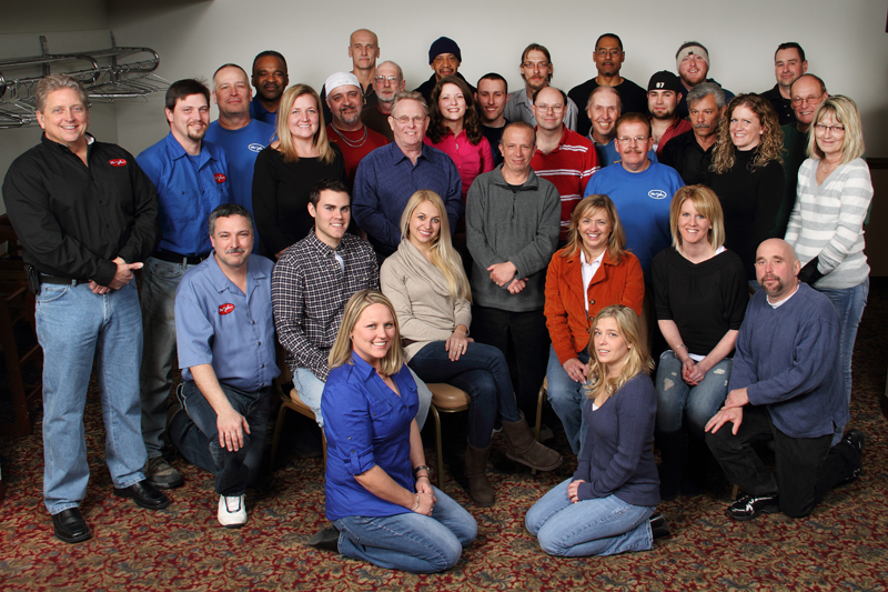 Mr. John employees posing in a group